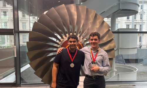 Kian and Shaan posing with their medals